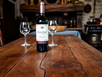 {"prompt":"a single bottle of expensive wine is sitting on a large wooden table with one wine glass behind it, in a medieval kitchen","originalPrompt":"a single bottle of expensive wine is sitting on a large wooden table with one wine glass behind it, in a medieval kitchen","width":1478,"height":1108,"seed":519556,"model":"flux","enhance":false,"nologo":true,"negative_prompt":"worst quality, blurry","nofeed":true,"safe":true,"quality":"medium","image":null,"isMature":false,"isChild":false}